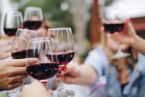 Girls cheersing with red wine