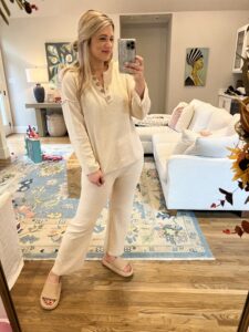 Lesley in a white Amazon sweater set